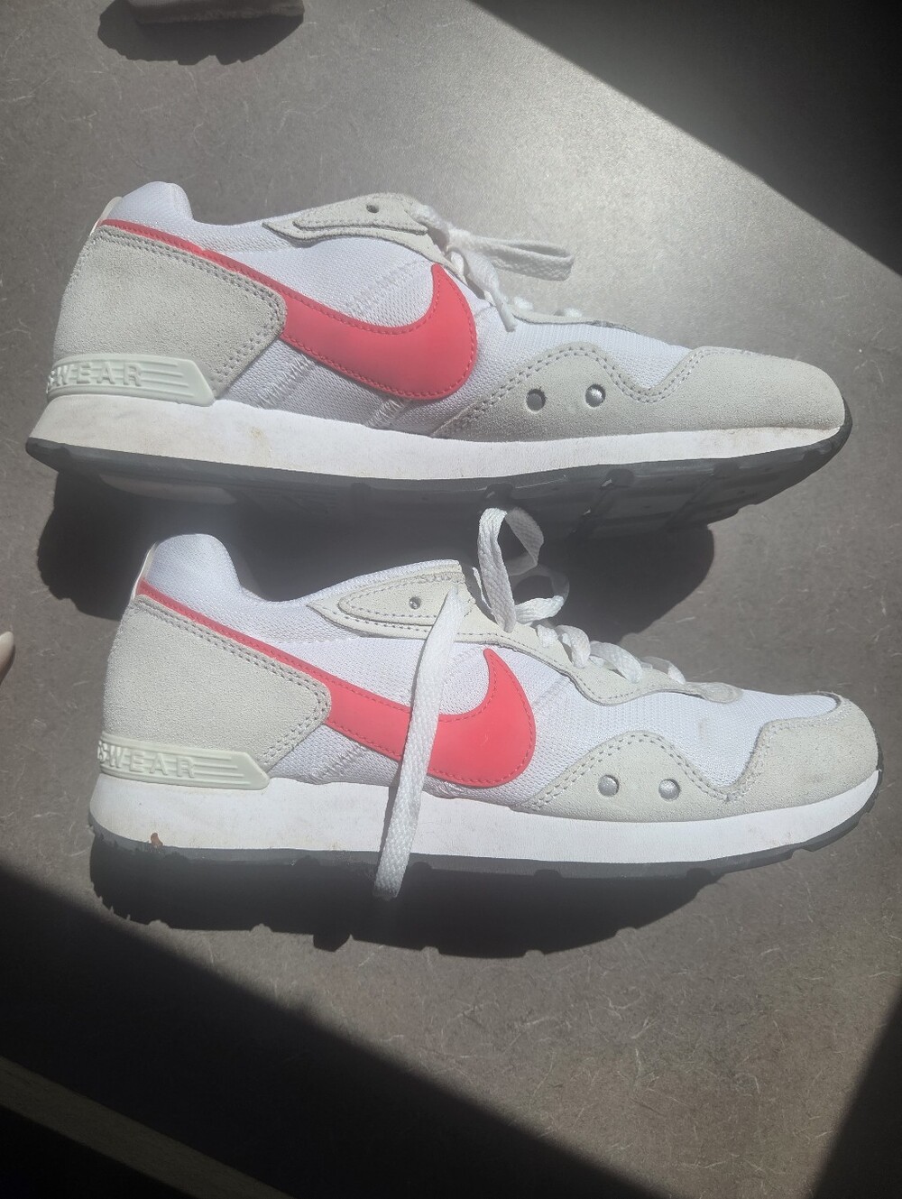 Nike Women's White Athletic Sneakers with Pink Accents